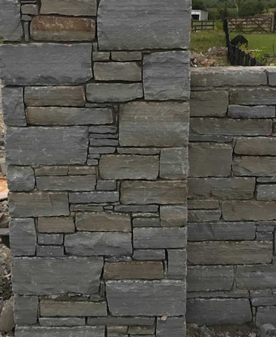 Grey sandstone with hand dressed corners and levellers