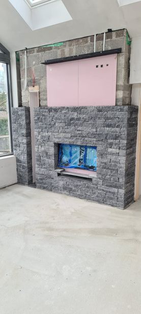 Flat linear limestone creating an internal feature fireplace