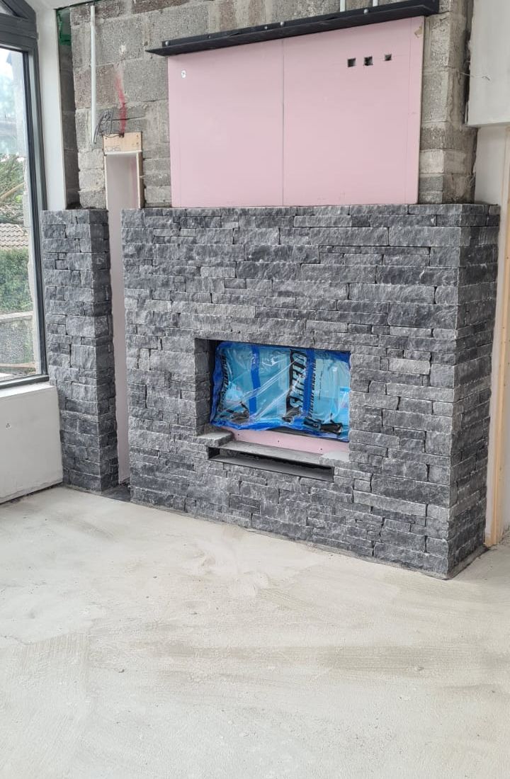 Flat linear limestone creating an internal feature fireplace