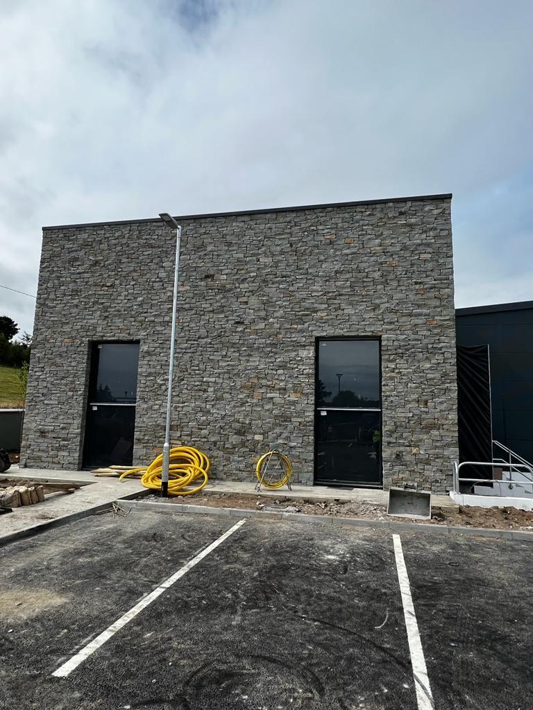 Grey sandstone cut flat to create a rustic linear look 