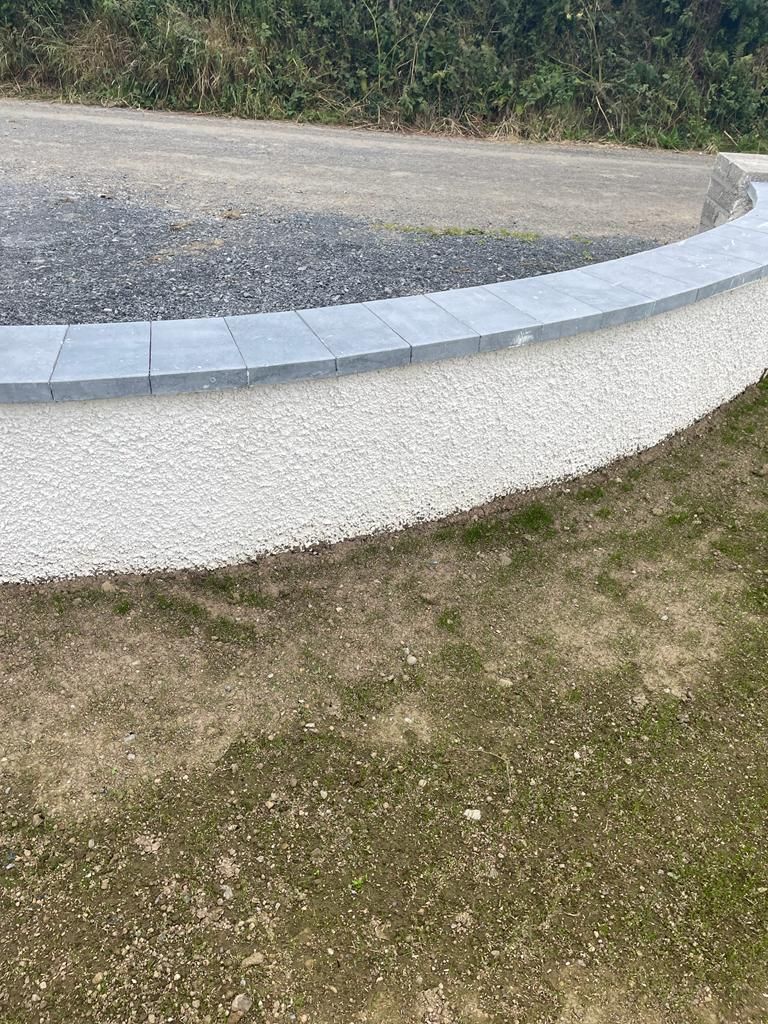 Sanded limestone wall capping used with a dashed plastered finish