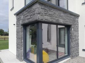 Modular cut limestone framing a corner window