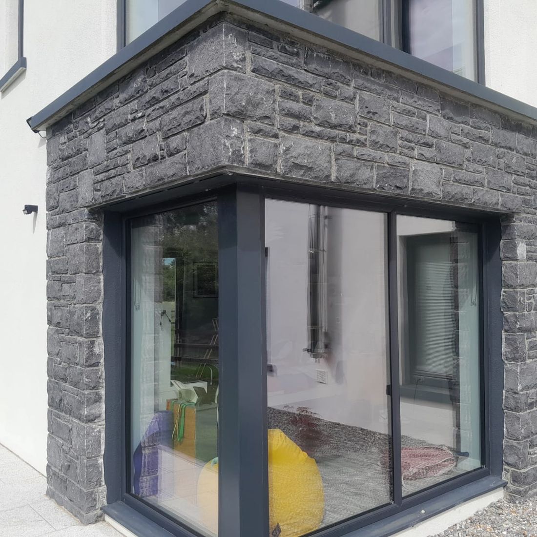 Modular cut limestone framing a corner window