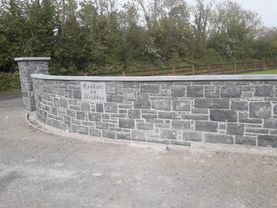 Cut regular limestone building stone finished with a sanded limestone wall cap