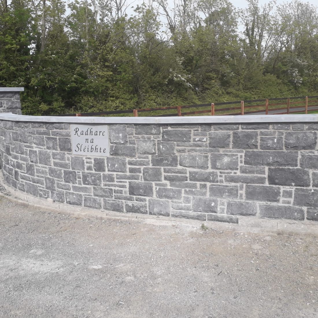 Cut regular limestone building stone finished with a sanded limestone wall cap