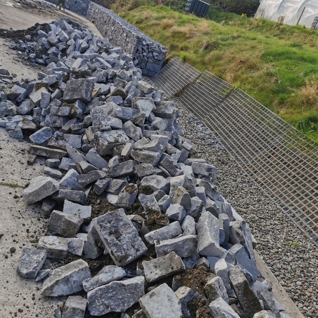 Gabions under construction using random white limestone 