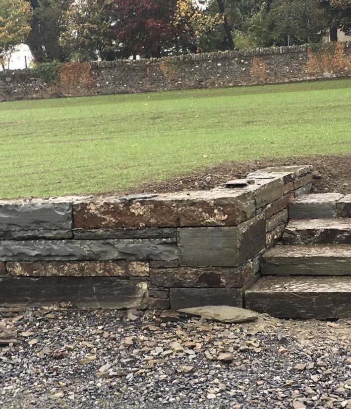 Rustic brown sandstone steps & retaining wall