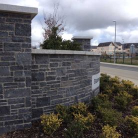 Dressed modular limestone with granite capping