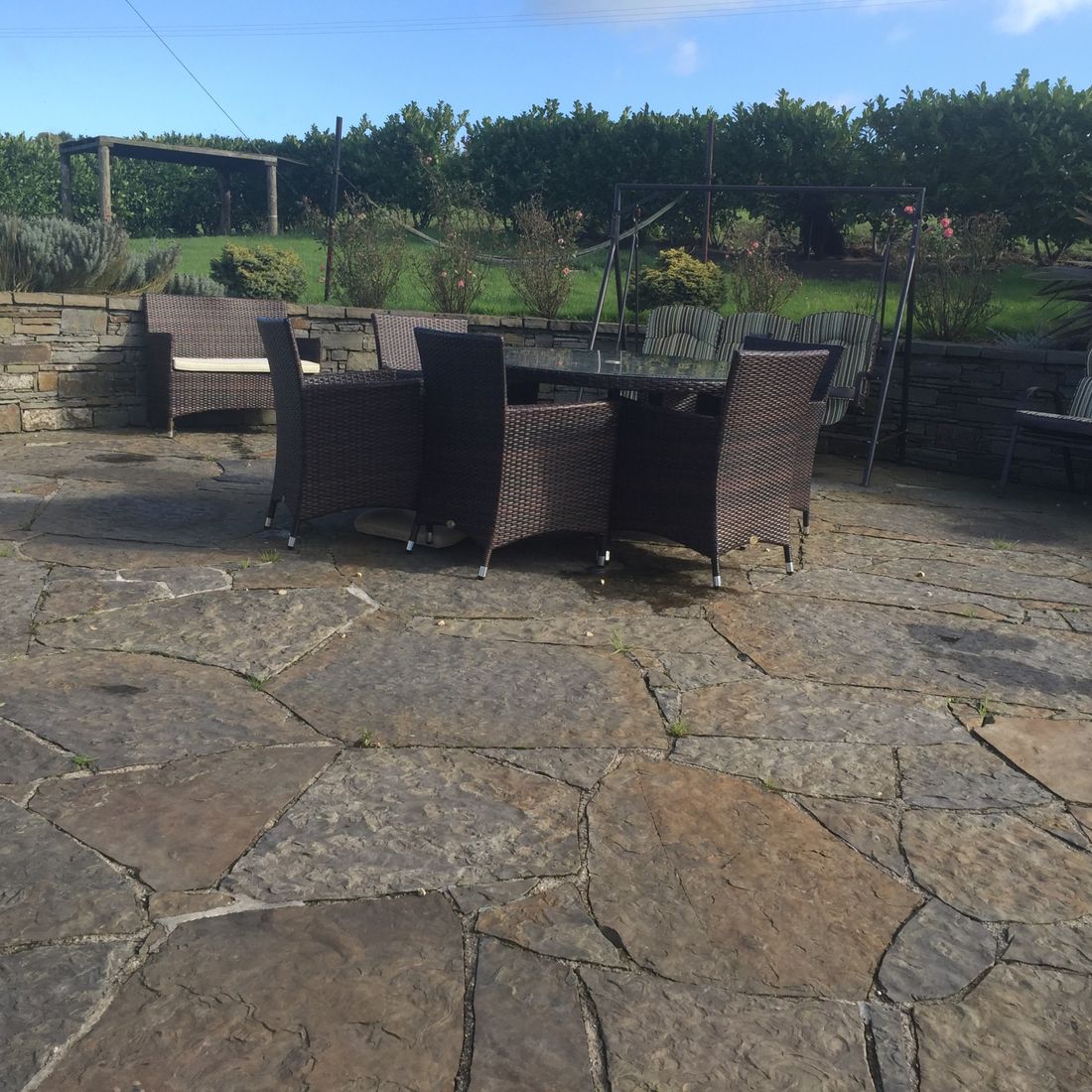 Random grey brown sandstone flag paving