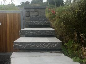 Stepped pitched rock face capping