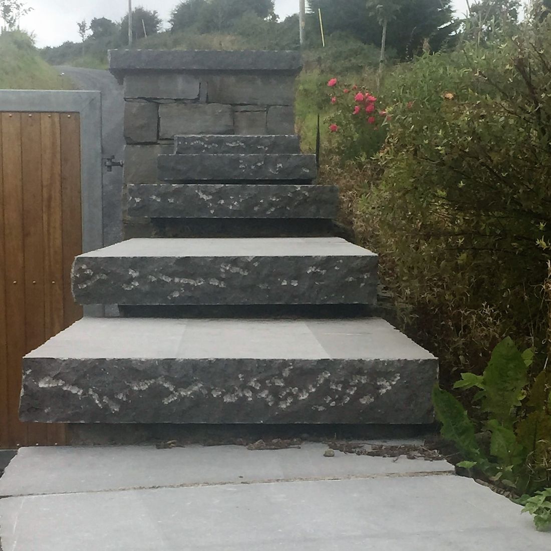 Stepped pitched rock face capping