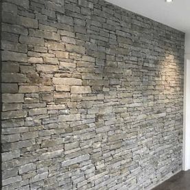 Flat linear grey should laid with traditional dry joint on an internal wall