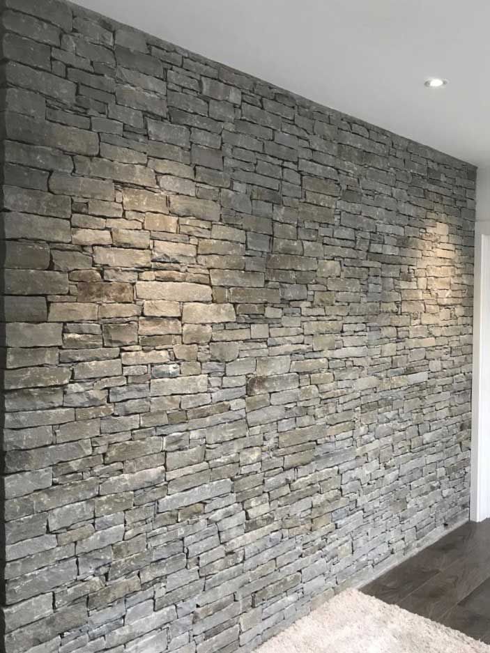 Flat linear grey should laid with traditional dry joint on an internal wall