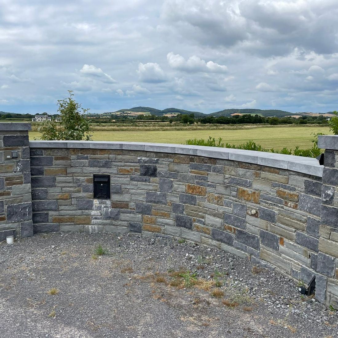 Sanded limestone wall & pier caps 