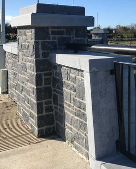 Sanded limestone wall capping complimenting modular blue limestone building stone