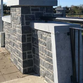 Sanded limestone wall capping complimenting modular blue limestone building stone