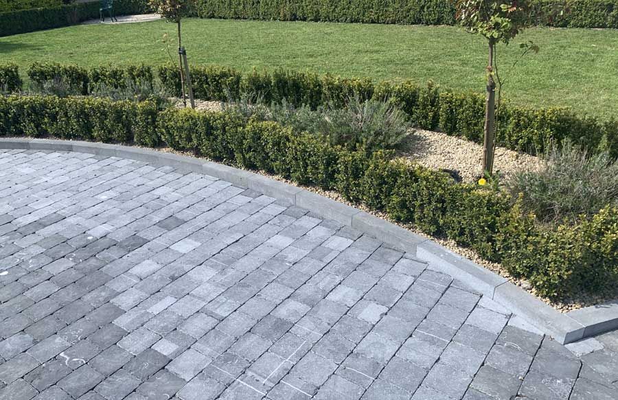 Limestone kerbs framing a limestone cobbled patio area