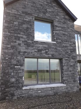 Modular cut limestone enhanced with Irish limestone window cills