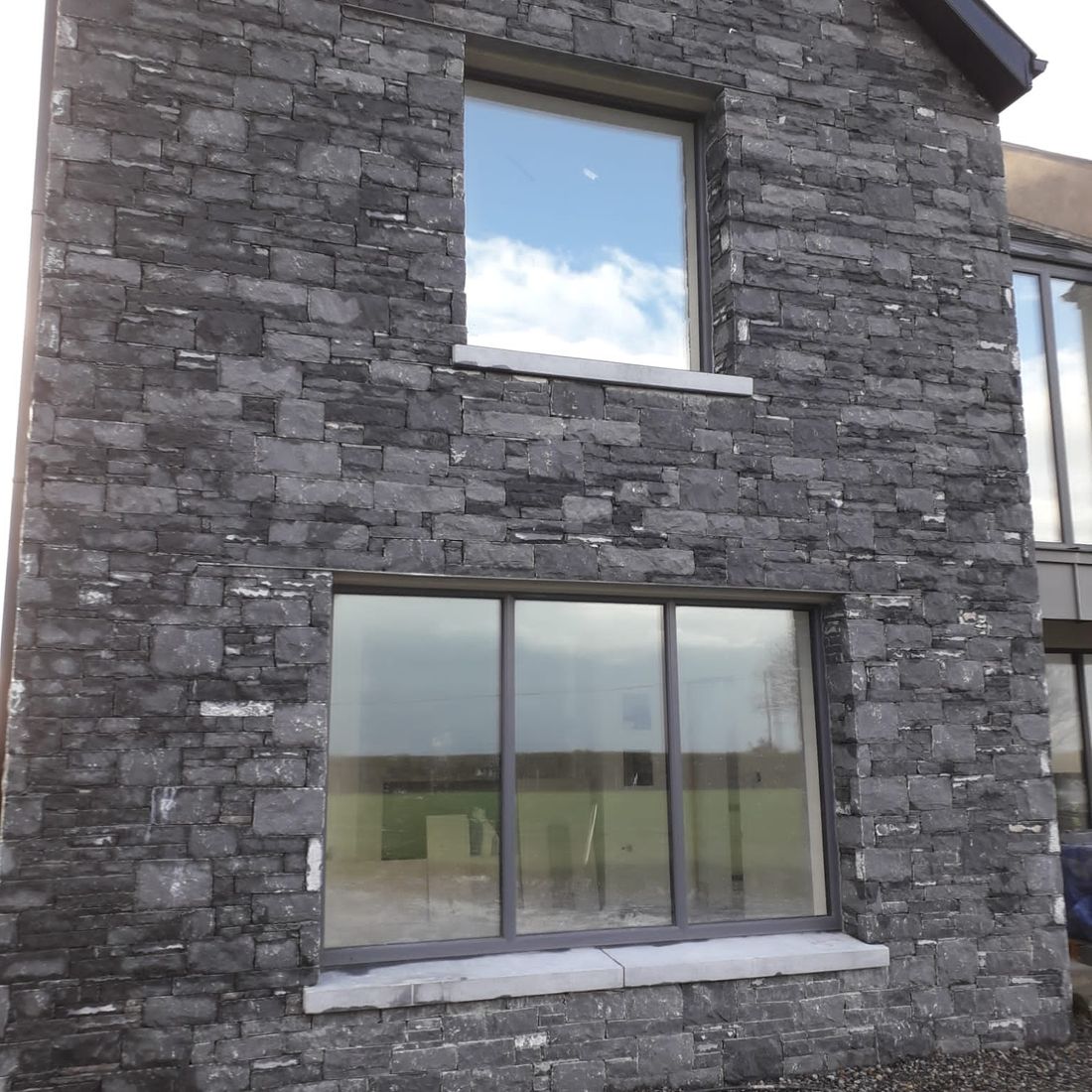 Modular cut limestone enhanced with Irish limestone window cills