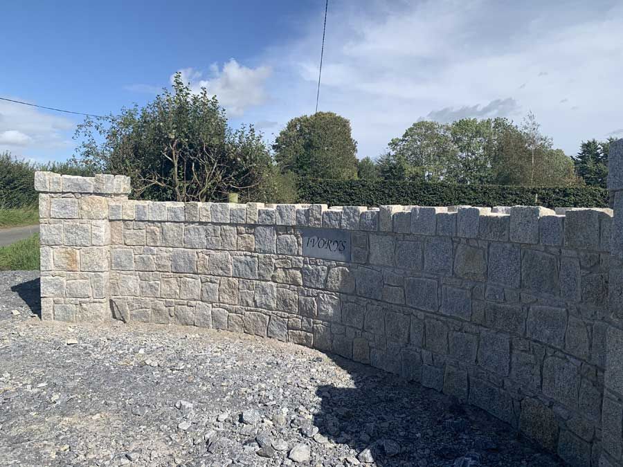 Grey & brown granite mix capped with hand dressed cock & hen capping