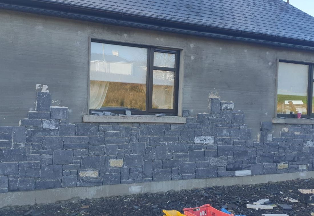 Modular cut limestone cladding being used to rejuvenate a bungalow 