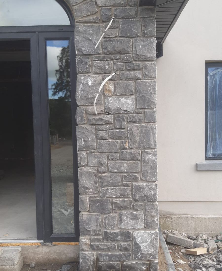 Random white limestone with dressed corner stones 