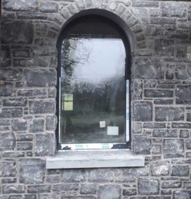 Random Kilkenny blue limestone with hand crafted arch and dressed cornerstones