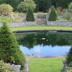 Sucken garden pond complimented with two tiered sandstone retaining wall