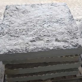 Grey sandstone pier caps with chiseled