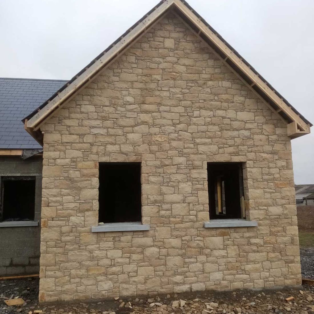 Cream sandstone with dressed corner stones 