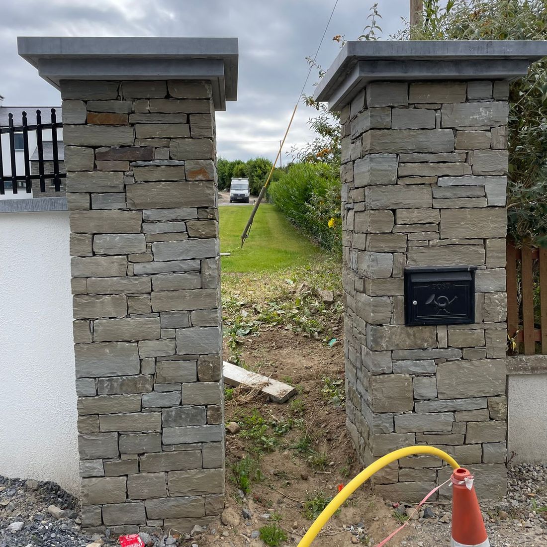 Double tier Irish limestone pier caps enhancing dry joint grey sandstone piers