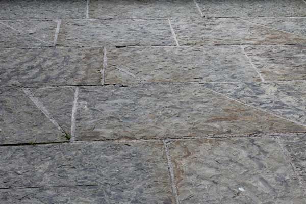 Cut regular grey brown paving