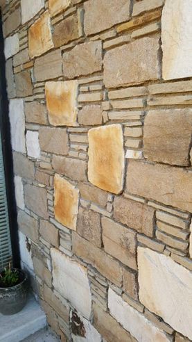 Split building stone mixed with levellers