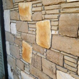 Split building stone mixed with levellers