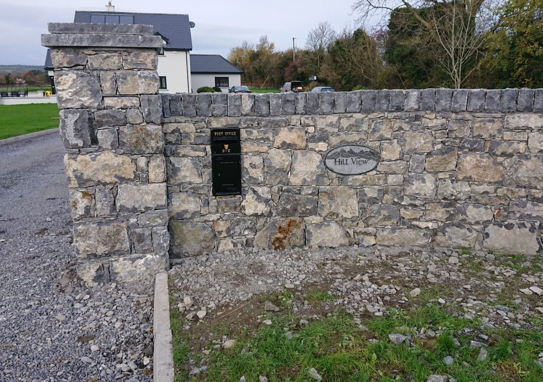 Hand dressed double tier rock face pier cap complimented with dressed soldier coarsing