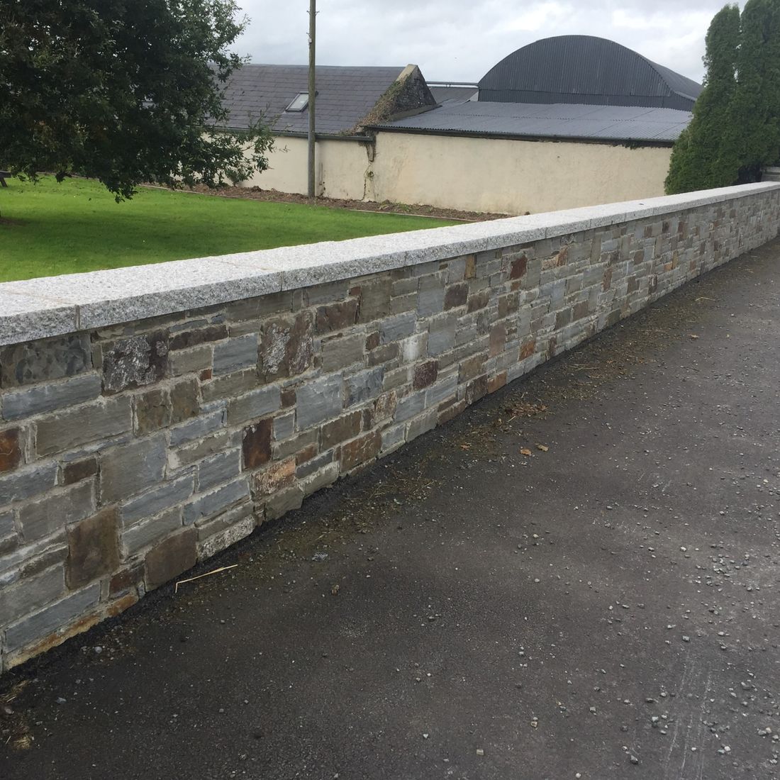 Grey sandstone finished with granite wall capping