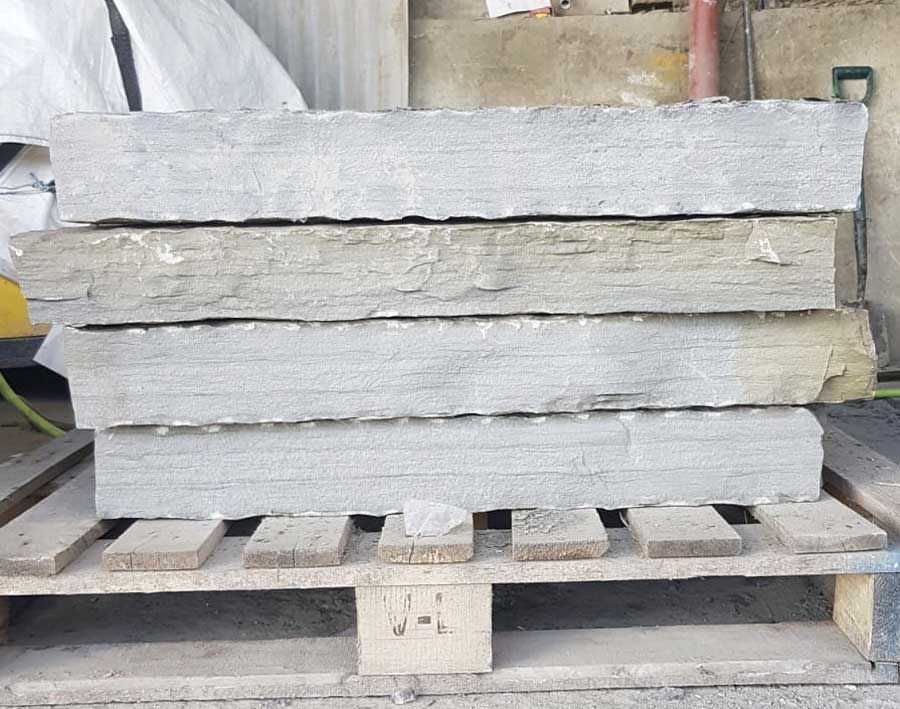 Dressed grey sandstone pier caps ready for delivery