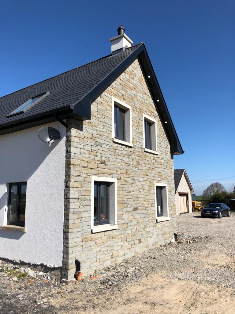 Grey sandstone built using a dry joint with dressed corner stones 