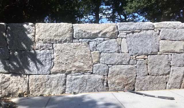 Large grey/brown granite mixed laid with dry joint