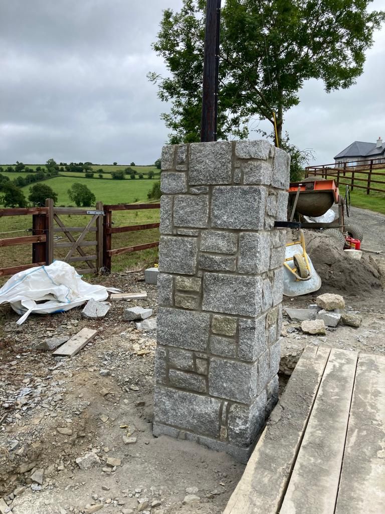 Grey granite pier with large dressed corner stones