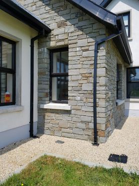 Grey sandstone with dressed corners and shades & tones