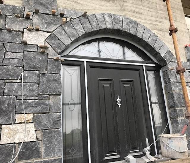 Modular limestone enhanced with hand dressed arch