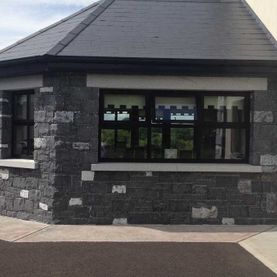Split modular complimented by grey granite cills and heads