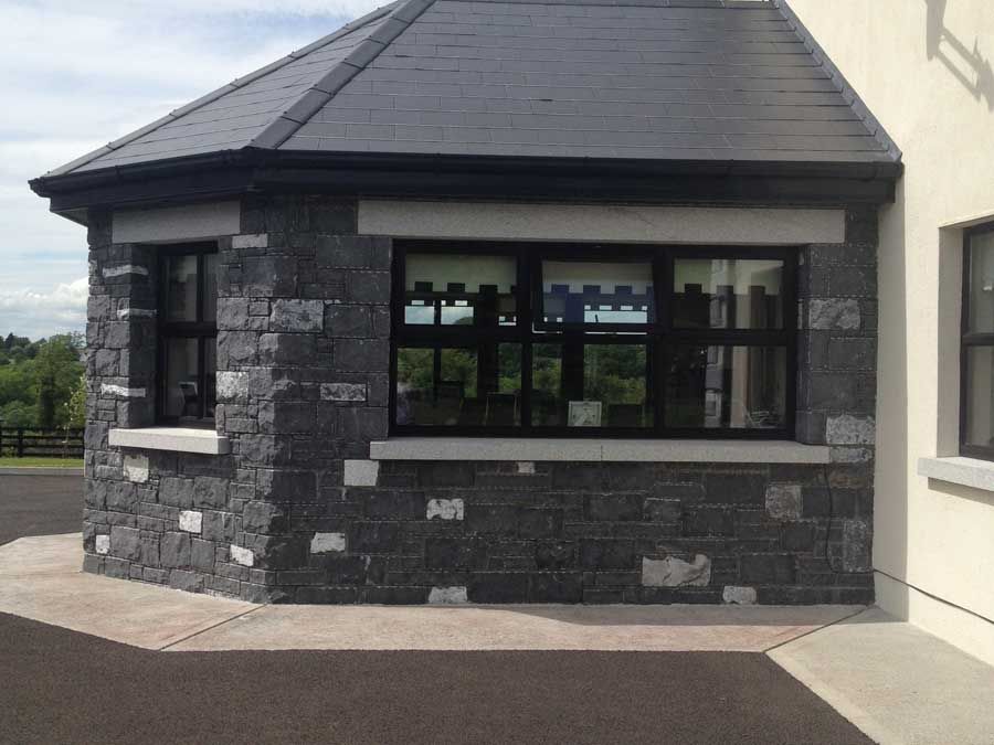 Split modular complimented by grey granite cills and heads