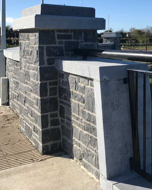 Modular limestone complimented with sanded limestone wall capping