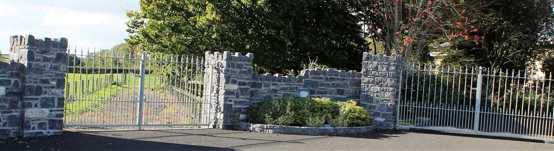 Random blue and white limestone entrance capped with traditional cock & hen