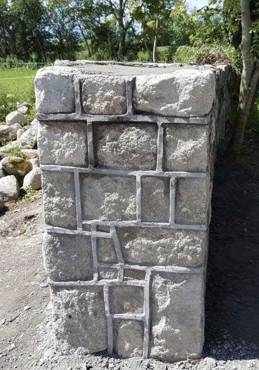 Brown granite pier with traditional raised joint