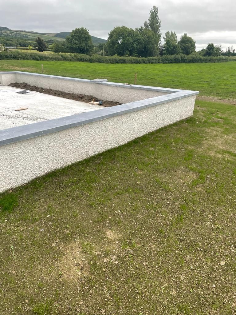 Sanded limestone wall capping used with a dashed plastered finish